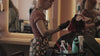 Camera rolling through the salon displaying hairdressers and clients receiving relaxing treatments.